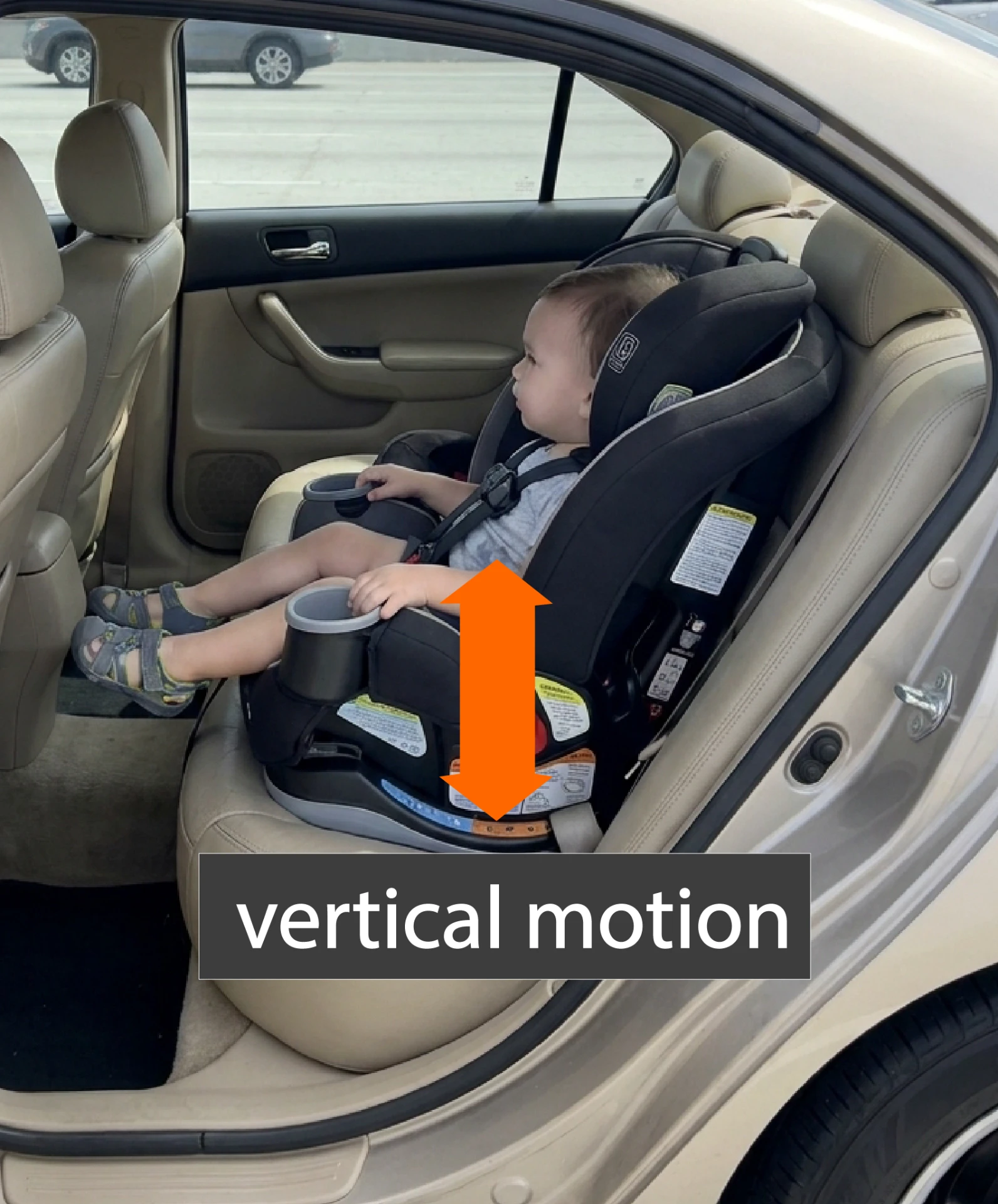 Child seat ride quality test showing vertical motion measured on a child safety seat