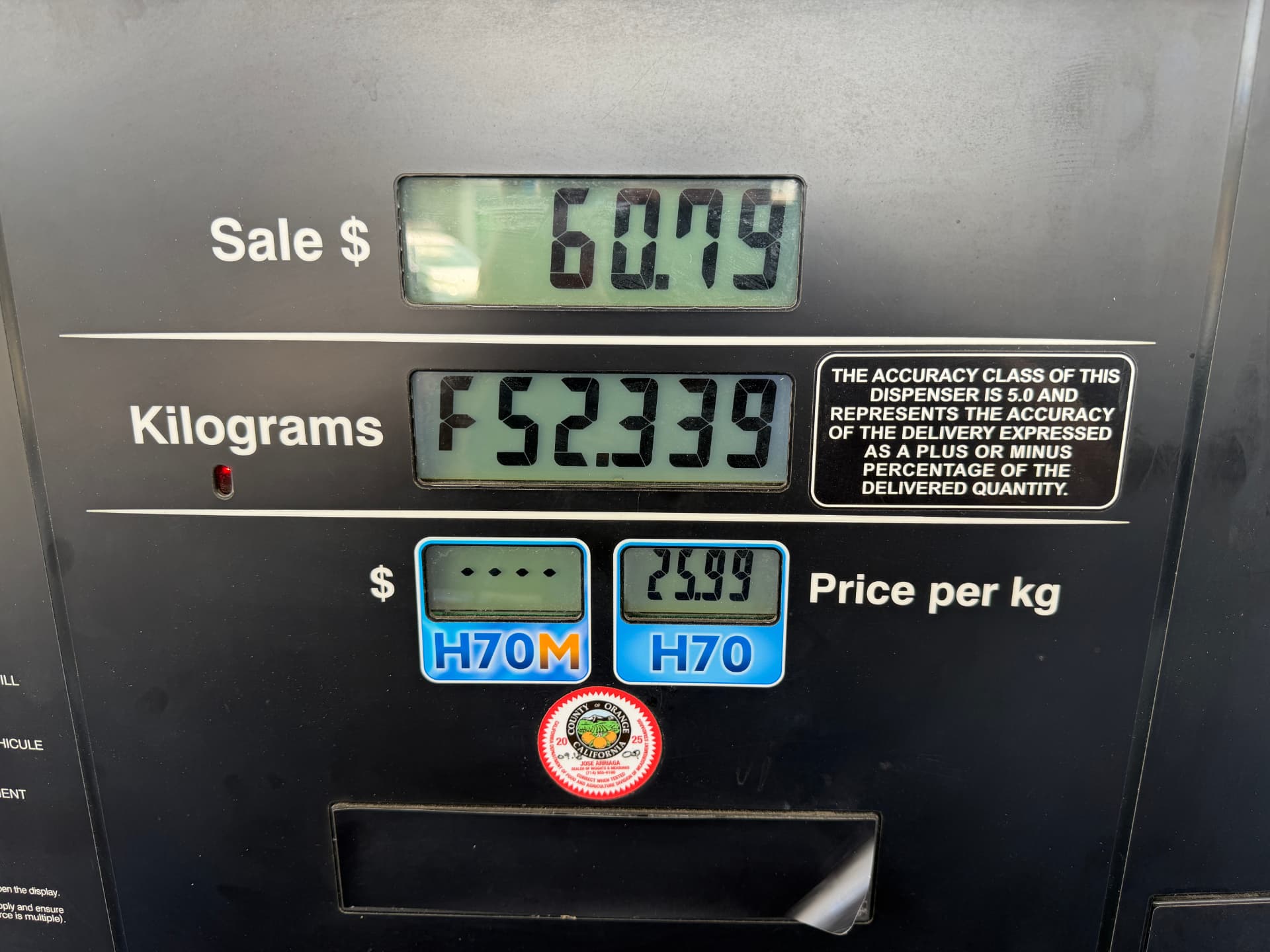 Close-up of the True Zero hydrogen pump display showing a sale of $60.79 for 2.339 kg at $25.99 per kg